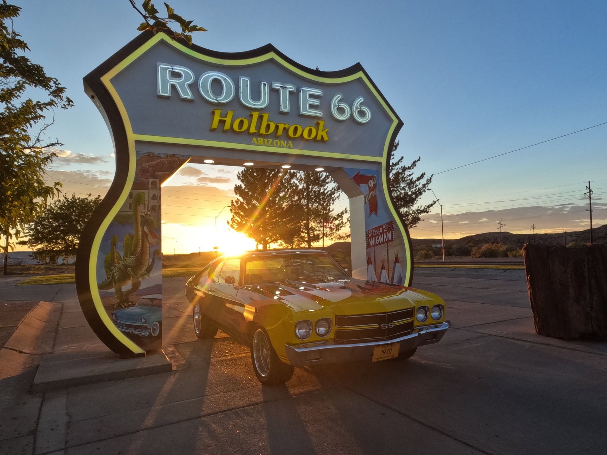 Classic Cars at the Route 66 Sign