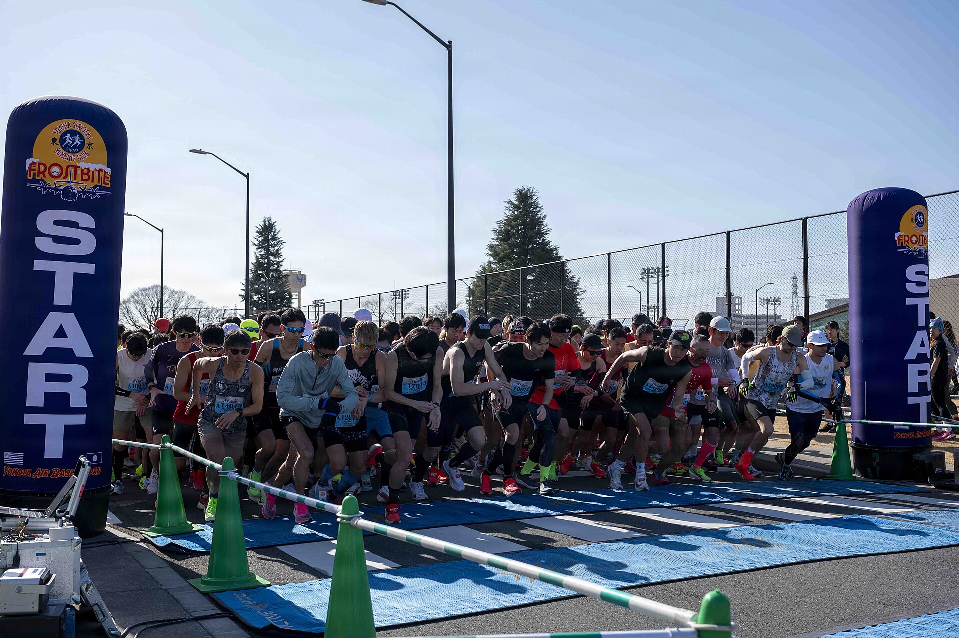 Runners at the start line of a community road race