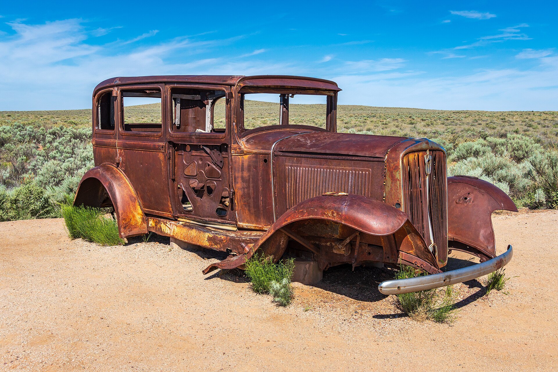 Rusted 1932 Studebaker sitting in the desert at the old Route 66 alignment in Petrified Forest National Park